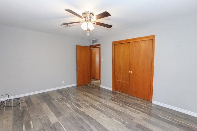 2004 State St, Big Spring, TX 79720 - unfurnished bedroom featuring wood finished floors, a closet, and ceiling fan