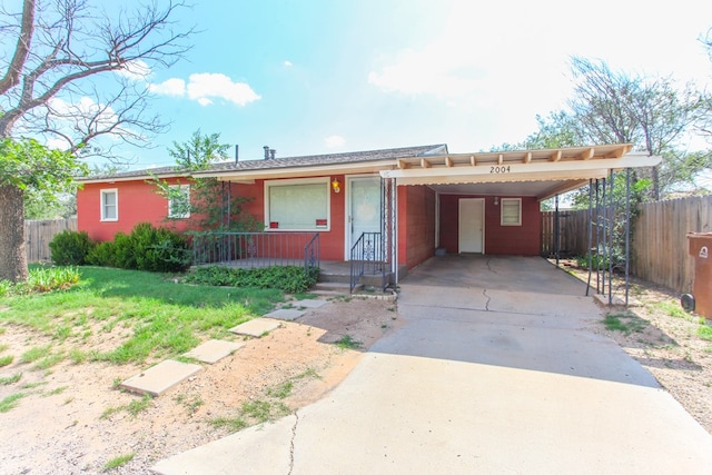 2004 State St, Big Spring, TX 79720 - single story home with driveway, an attached carport, and a porch