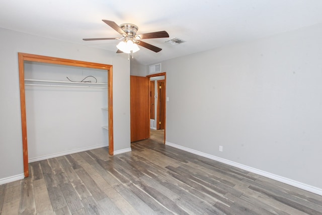 2004 State St, Big Spring, TX 79720 - unfurnished bedroom with wood finished floors, a closet, and ceiling fan