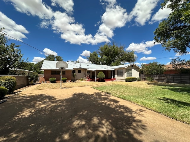 back of property with a lawn