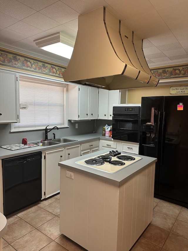 kitchen with island exhaust hood, a center island, white cabinetry, and black appliances