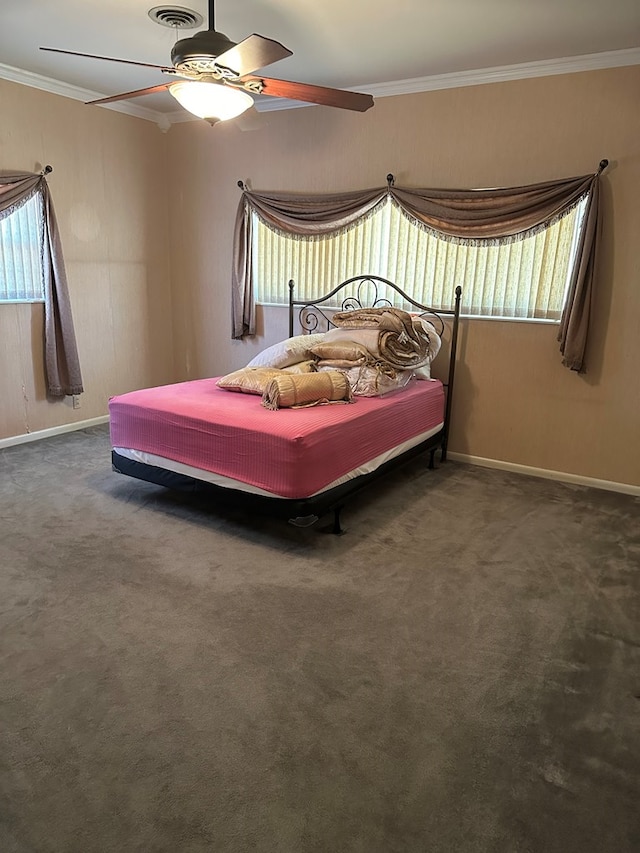 bedroom with dark colored carpet, ceiling fan, and crown molding