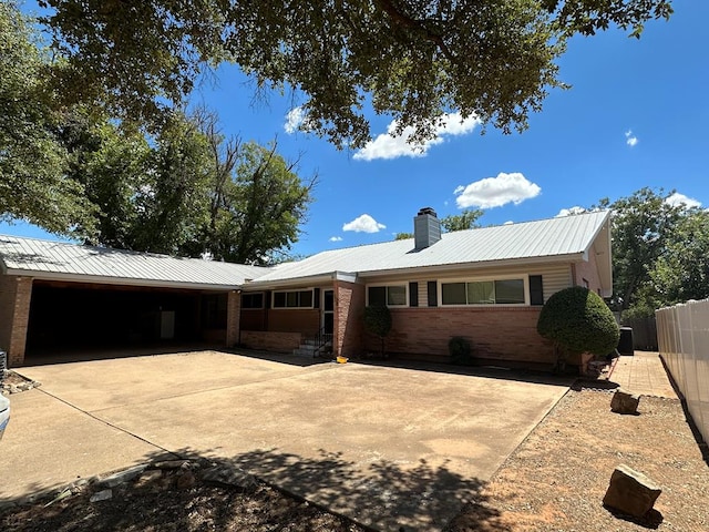 ranch-style home with a carport