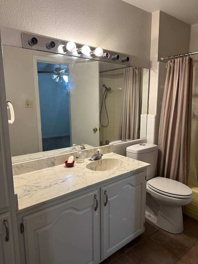 full bathroom featuring shower / bath combo, vanity, ceiling fan, tile patterned flooring, and toilet