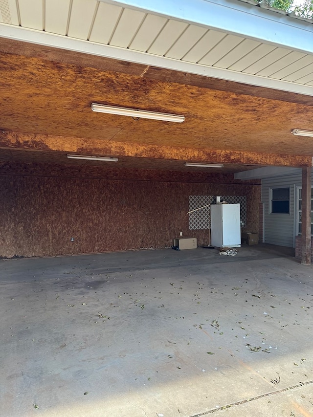 garage featuring white fridge