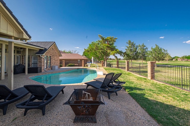 view of swimming pool with a patio, a fenced backyard, a fenced in pool, and a lawn