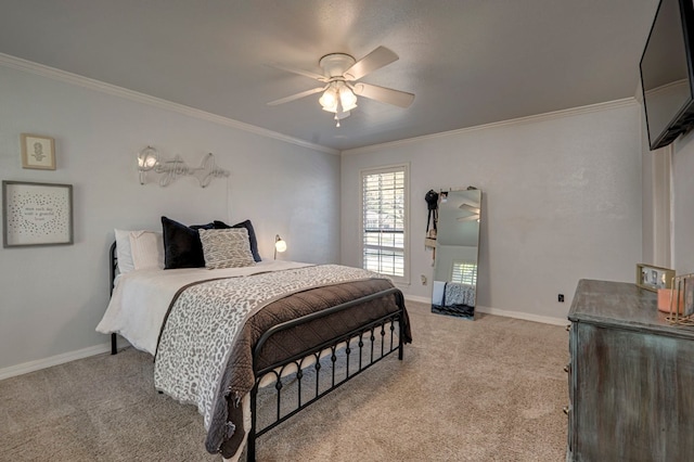 bedroom featuring crown molding, baseboards, and light carpet