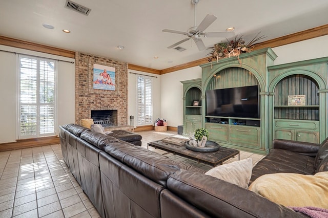 living room with visible vents, ceiling fan, light tile patterned flooring, and a healthy amount of sunlight
