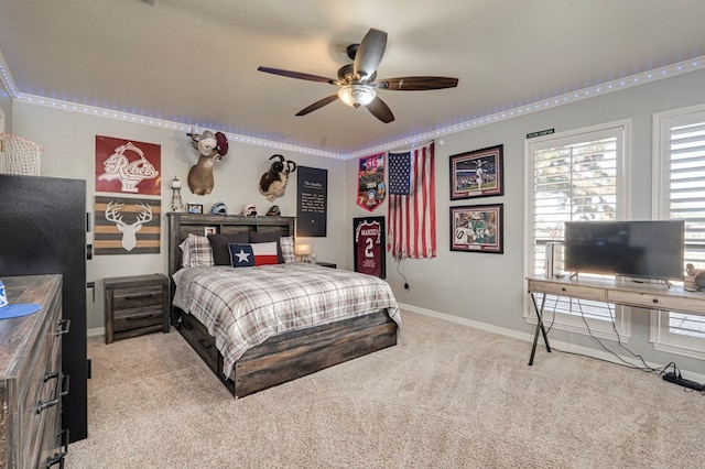 bedroom with baseboards and carpet