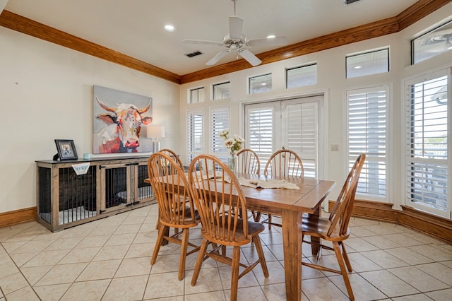 dining space with crown molding, visible vents, a ceiling fan, and light tile patterned flooring