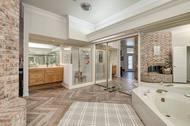 bathroom with crown molding, a shower stall, vanity, a brick fireplace, and a jetted tub