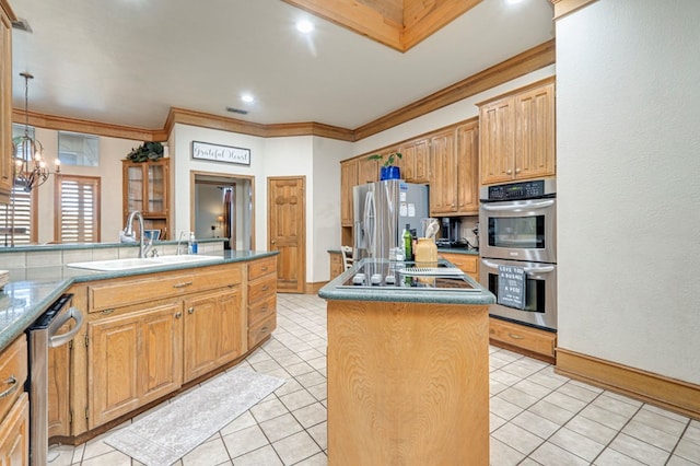 kitchen with a sink, a center island, appliances with stainless steel finishes, and crown molding