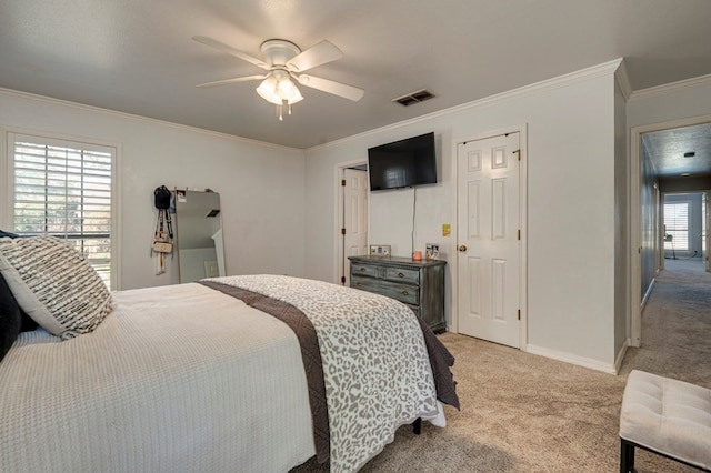 bedroom with baseboards, ornamental molding, light carpet, visible vents, and ceiling fan