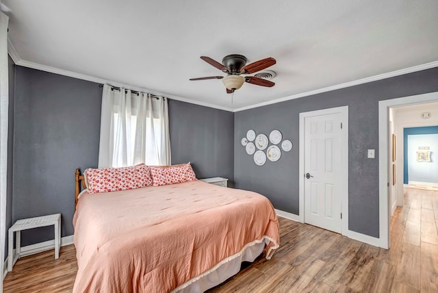 611 Storey Ave, Midland, TX 79703 - bedroom featuring light wood finished floors, baseboards, ornamental molding, and a ceiling fan