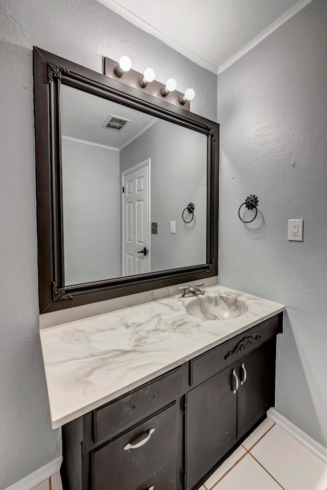 611 Storey Ave, Midland, TX 79703 - bathroom with vanity, crown molding, baseboards, and tile patterned floors