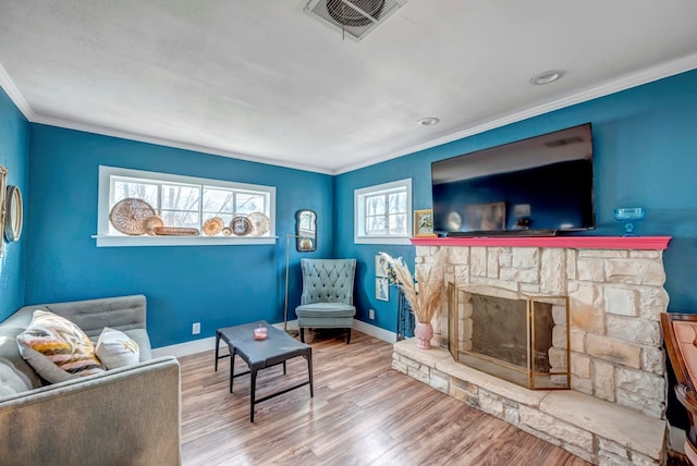 611 Storey Ave, Midland, TX 79703 - living room featuring crown molding, wood finished floors, baseboards, and a fireplace