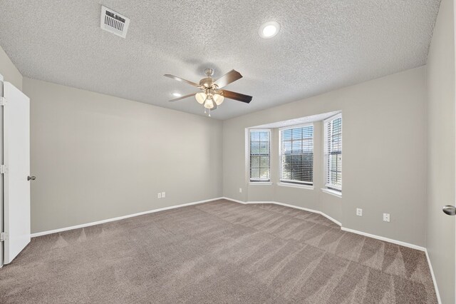 3237 Preston Dr, Midland, TX 79707 - empty room featuring ceiling fan, carpet flooring, and a textured ceiling