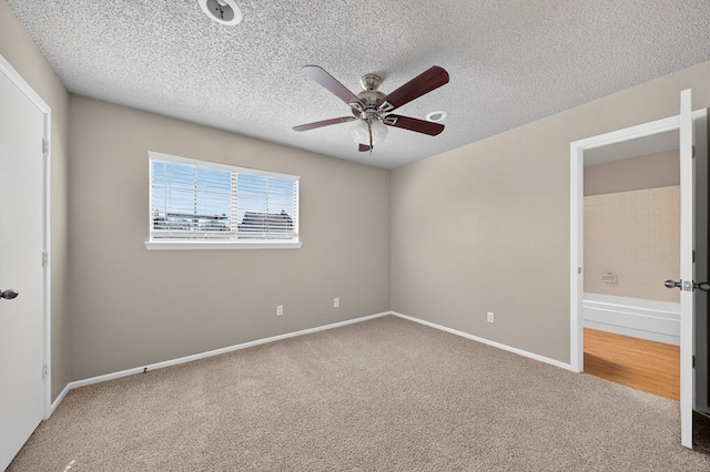 3237 Preston Dr, Midland, TX 79707 - unfurnished bedroom featuring carpet floors, a textured ceiling, and ceiling fan