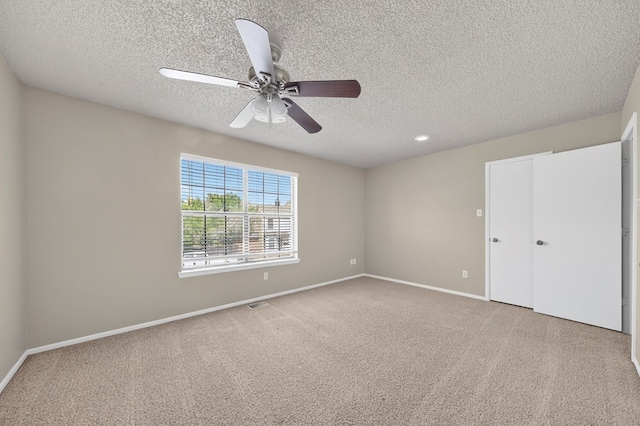 3237 Preston Dr, Midland, TX 79707 - unfurnished bedroom with a textured ceiling, carpet, ceiling fan, and recessed lighting