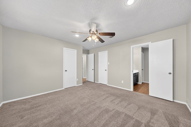 3237 Preston Dr, Midland, TX 79707 - unfurnished bedroom with carpet floors, a textured ceiling, ensuite bath, recessed lighting, and a ceiling fan