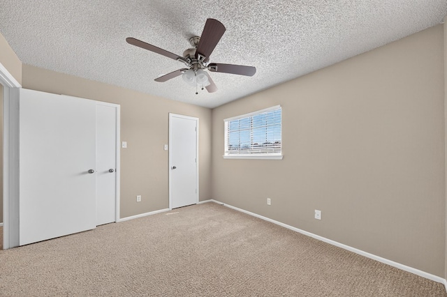 3237 Preston Dr, Midland, TX 79707 - unfurnished bedroom featuring a textured ceiling, carpet, and a ceiling fan