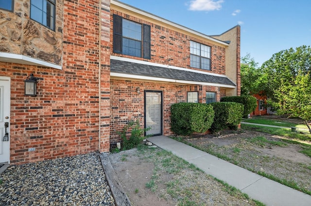 3237 Preston Dr, Midland, TX 79707 - view of front of home featuring brick siding and roof with shingles