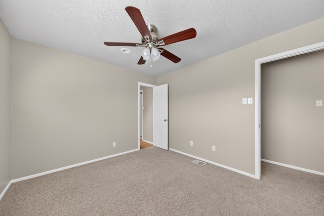 3237 Preston Dr, Midland, TX 79707 - unfurnished bedroom with carpet, a ceiling fan, and a textured ceiling