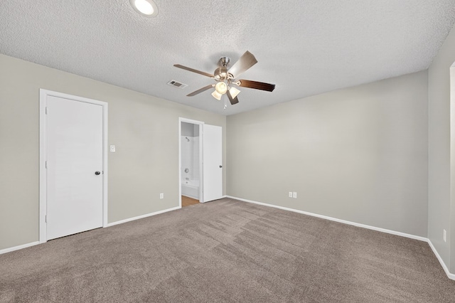 3237 Preston Dr, Midland, TX 79707 - unfurnished bedroom with carpet floors, a textured ceiling, ensuite bathroom, and a ceiling fan