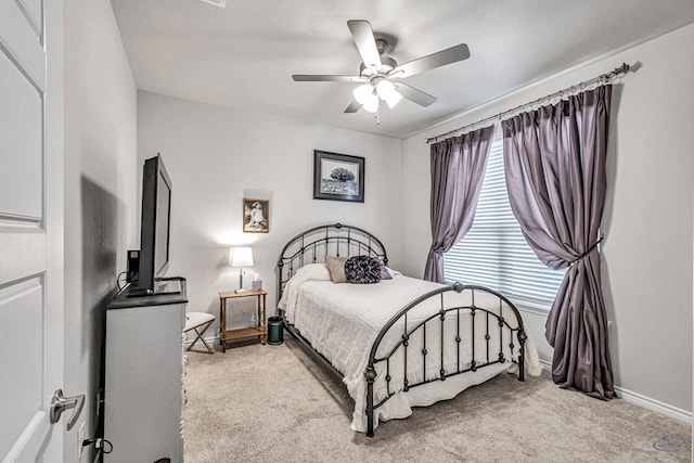 bedroom featuring carpet flooring, baseboards, and a ceiling fan