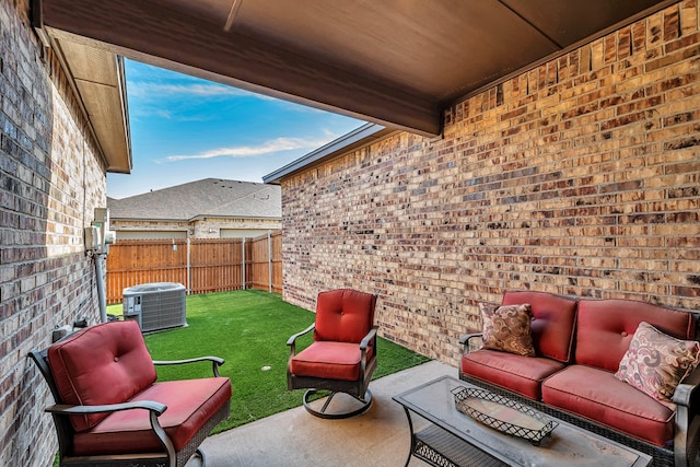 view of patio featuring central air condition unit, outdoor lounge area, and a fenced backyard