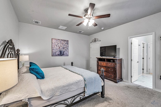 bedroom with visible vents, light carpet, and ceiling fan