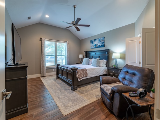 bedroom with dark wood-type flooring, visible vents, a ceiling fan, and lofted ceiling
