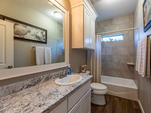 full bath featuring shower / bathtub combination with curtain, wood finished floors, toilet, and vanity