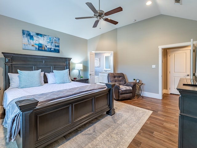 bedroom with light wood-style floors, ceiling fan, visible vents, baseboards, and vaulted ceiling