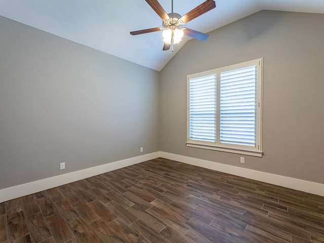 unfurnished room featuring dark wood-style floors, ceiling fan, plenty of natural light, and vaulted ceiling