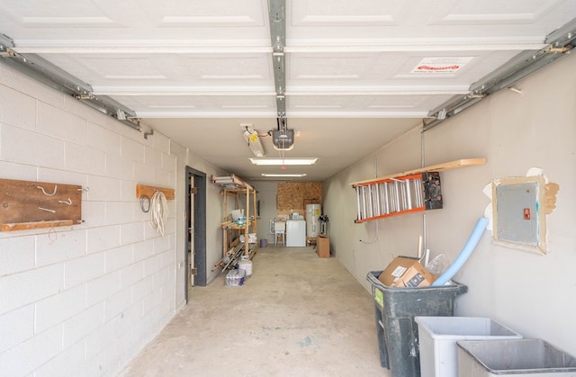 garage featuring a garage door opener and electric panel