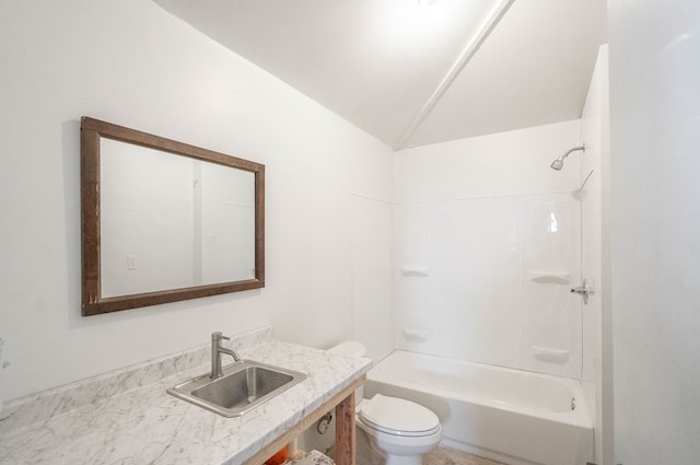 full bathroom featuring vaulted ceiling, vanity, shower / bathtub combination, and toilet