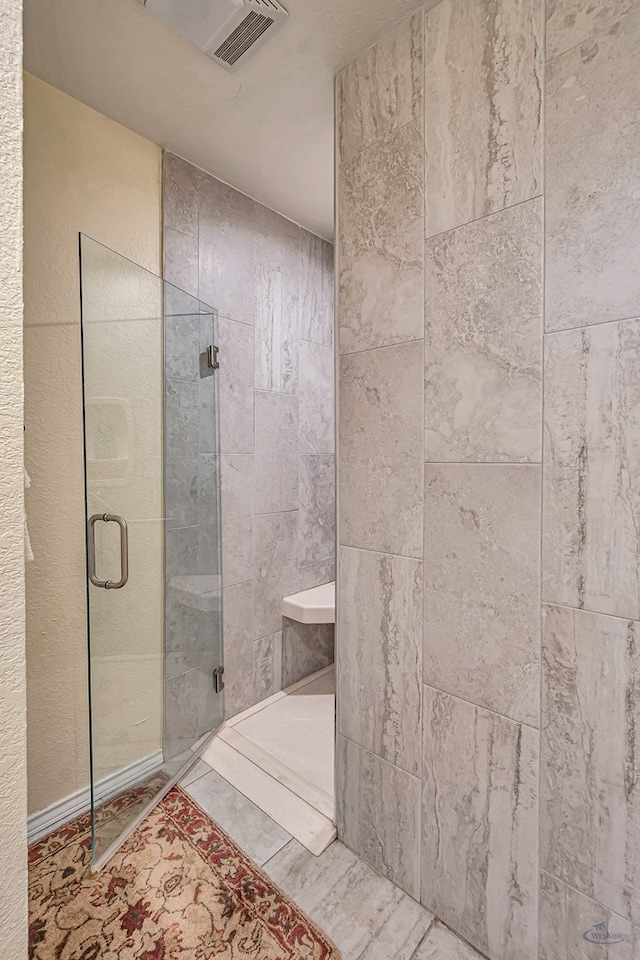 bathroom featuring an enclosed shower