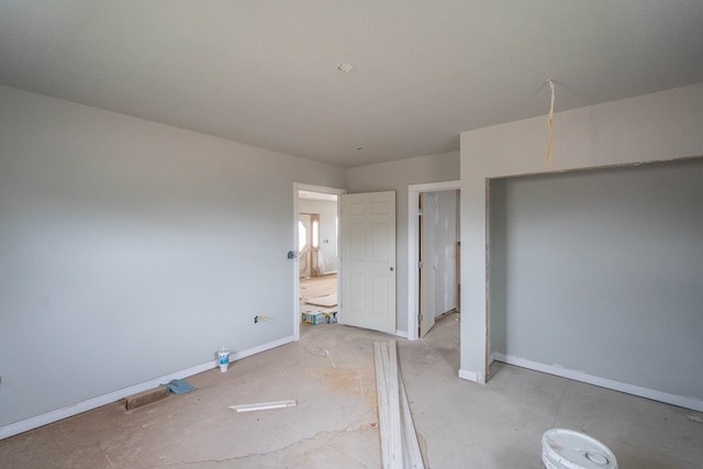 unfurnished bedroom with baseboards