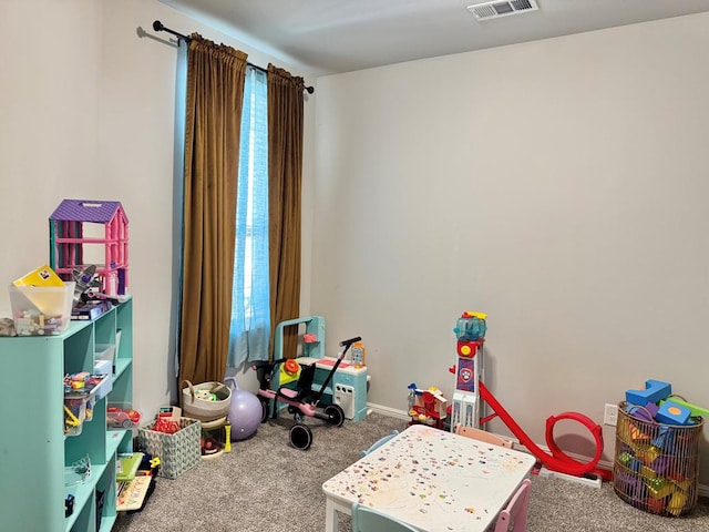 playroom featuring baseboards, plenty of natural light, visible vents, and carpet flooring