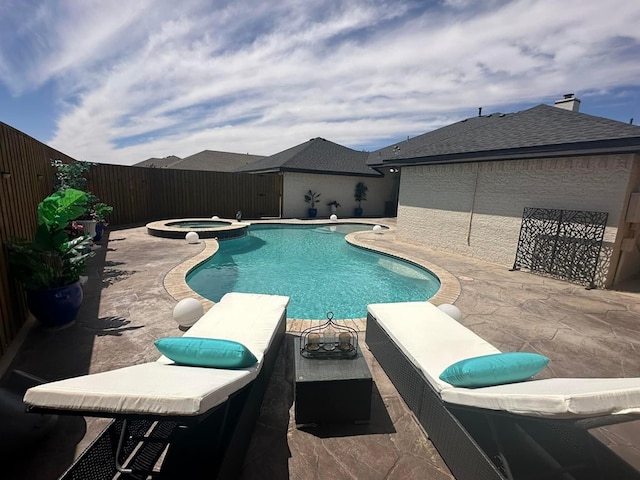 view of pool featuring an in ground hot tub and a patio