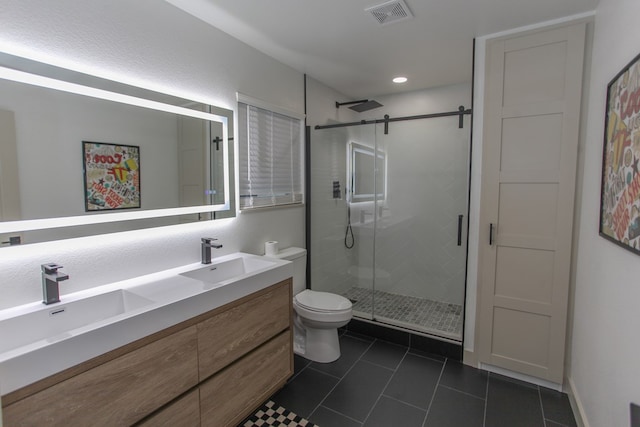 bathroom featuring tile patterned flooring, an enclosed shower, vanity, and toilet