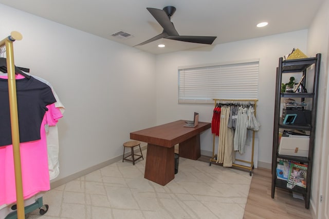 office featuring ceiling fan and light hardwood / wood-style flooring