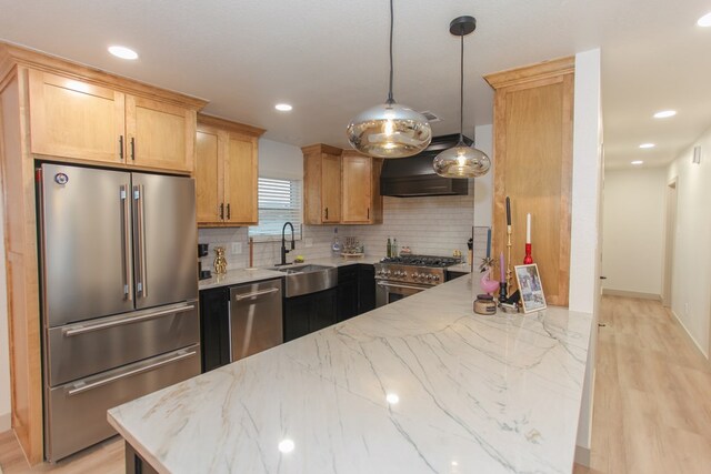 kitchen featuring premium range hood, hanging light fixtures, high end appliances, light stone countertops, and decorative backsplash