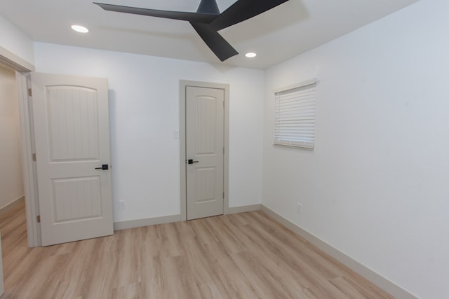 unfurnished bedroom featuring light hardwood / wood-style flooring and ceiling fan