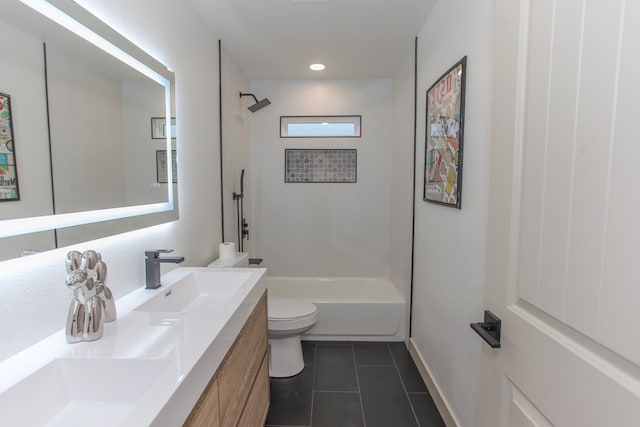 full bathroom with tiled shower / bath, tile patterned floors, toilet, and vanity