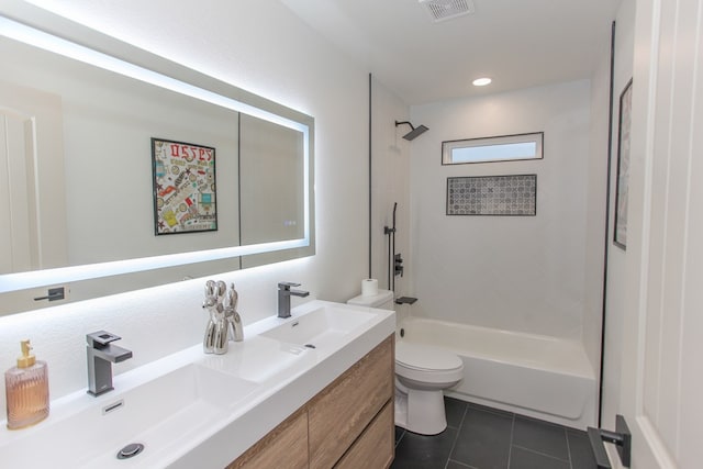 full bathroom with tiled shower / bath, vanity, toilet, and tile patterned flooring