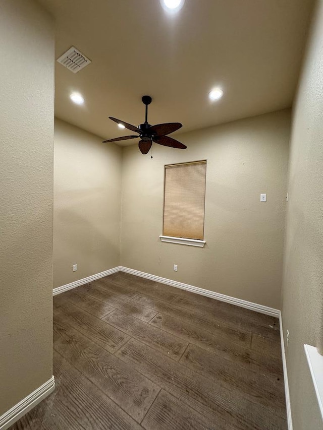 empty room featuring ceiling fan and dark hardwood / wood-style floors