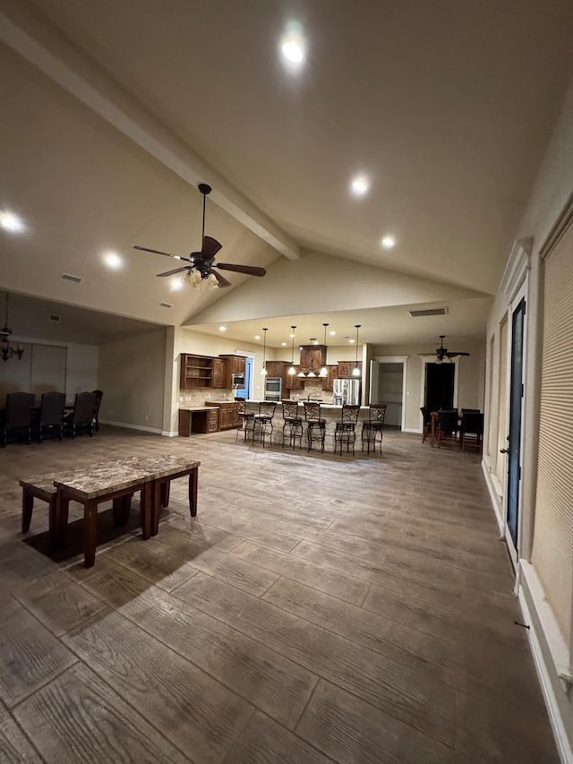 game room featuring beamed ceiling, ceiling fan, dark wood-type flooring, and high vaulted ceiling