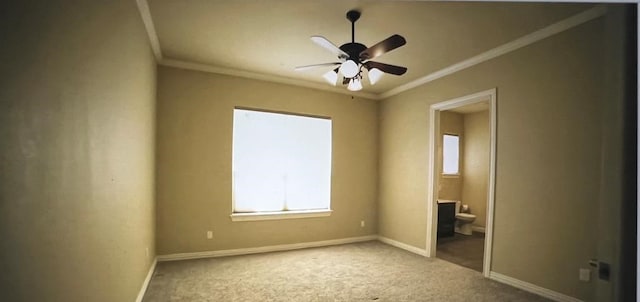 unfurnished bedroom with crown molding, carpet flooring, ensuite bathroom, and ceiling fan